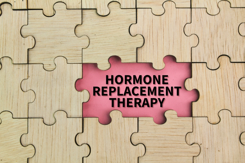 Wooden,puzzle,and,pink,background,with,the,word,hormone,replacement